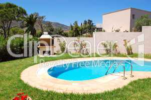 Grill at swimming pool by luxury villa, Crete, Greece