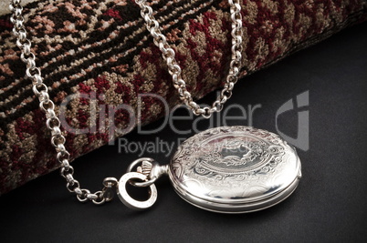 Closed silver pocket watch