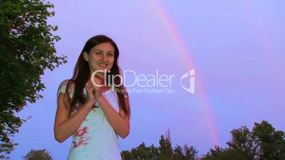 Girl on the background of the rainbow