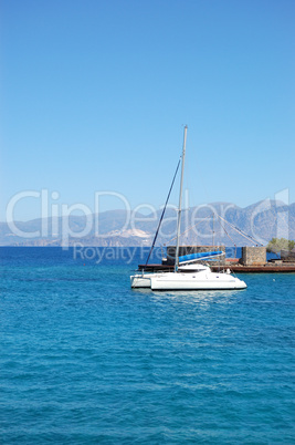 Luxury yacht and turquoise Aegean Sea, Crete, Greece