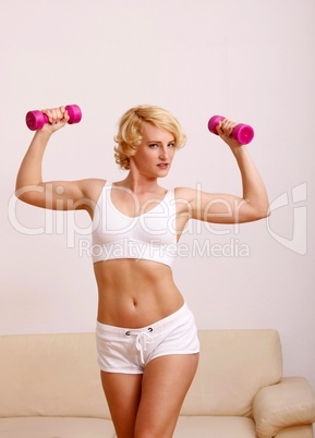 blond woman with dumbell