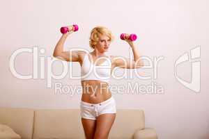 blond woman with dumbell