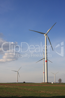 wind turbines under blue sky