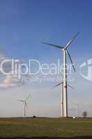 wind turbines under blue sky