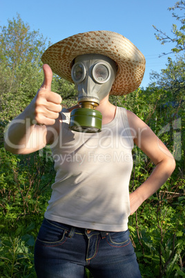 woman in gas-mask at garden work
