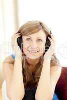 Young woman is listening the music in the living-room