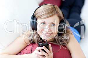 Teen woman is listening the music in the living-room
