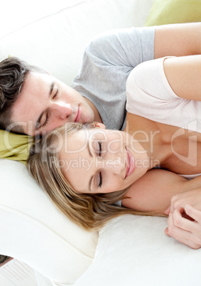 Sleeping lovers having fun together on a sofa