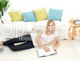 Cute woman is reading a book
