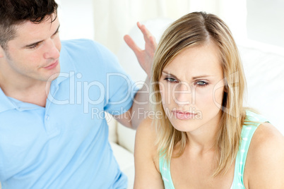 Young couple having an argue in the living-room