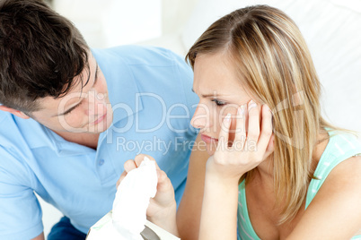 Tired couple having an argue in the living-room