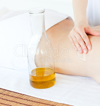 Cute woman having a massage with massage oil