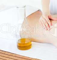 Cute woman having a massage with massage oil
