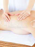 Delighted woman having a massage with massage oil