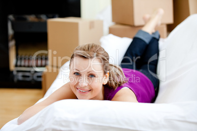 Cheerful woman having a break between boxes
