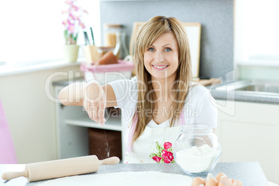 Attractive woman cooking cakes in the kitchen