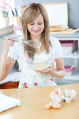 Cute woman preparing a meal in the kitchen