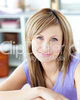 Delighted woman looking at the camera in the kitchen