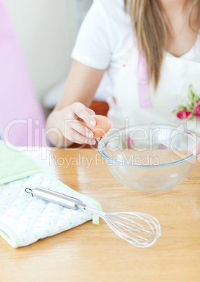 Portrait of a cute woman preparing a meal in the kitchen