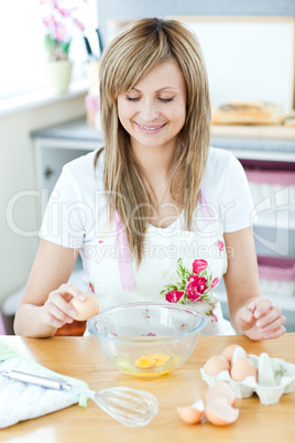 Portrait of a cheerful woman preparing a meal in the kitchen