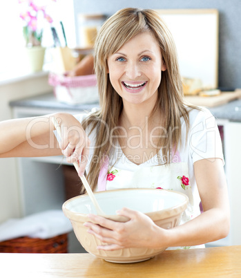 Close-up of a caucasian woman preparing a cake in the kitchen