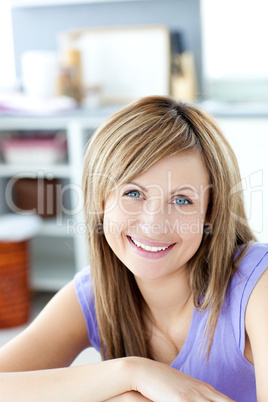 Smiling woman looking at the camera the kitchen