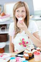 Bright woman preparing cakes in the kitchen
