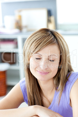 Delighted woman relaxing in the kitchen
