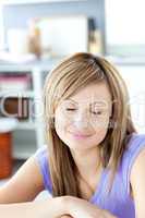 Delighted woman relaxing in the kitchen