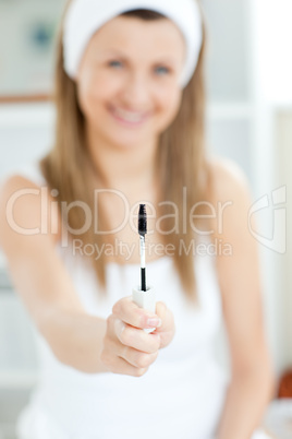 Delighted woman is holding make-up