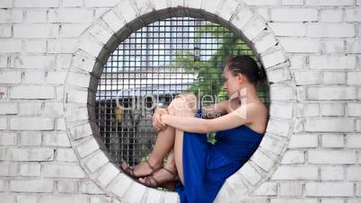 Sad woman sitting outdoor