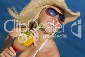 Beautiful Blond Woman Drinking Cocktail By The Sea