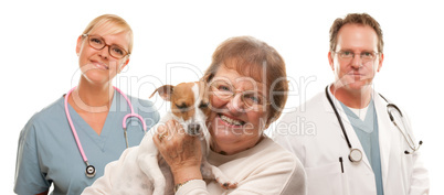 Happy Senior Woman with Dog and Veterinarian Team