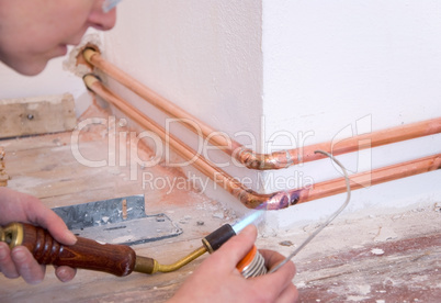 plumber and soldering gun