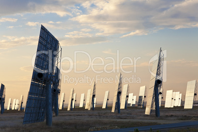 Green Energy Solar Mirror Panels at Sunset or Sunrise