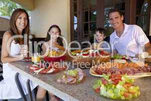 Attractive Family Eating Healthy Salad and Food Meal