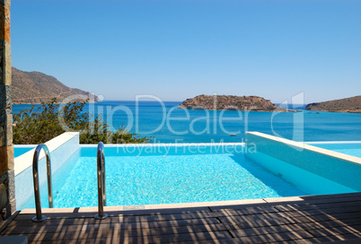 Swimming pool by luxury villa with a view on Spinalonga Island,