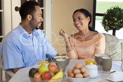 Happy African American Couple Sitting Outside Having A Healthy B