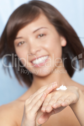 Beautiful Chinese Asian Woman Apply Moisturising Hand Cream