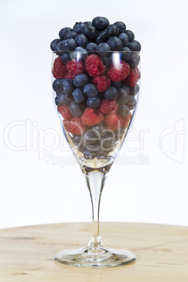 Glass Full of Blueberries and Raspberries
