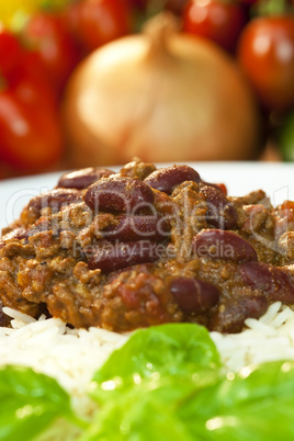 Chili Con Carne On Rice With Basil Garnish