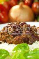 Chili Con Carne On Rice With Basil Garnish