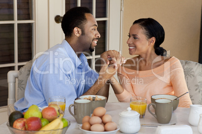 Happy African American Couple Holding Hands At Healthy Breakfast