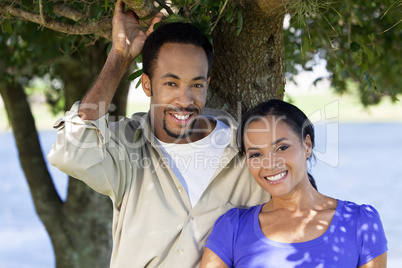 Happy African American Couple Together Under A Tree