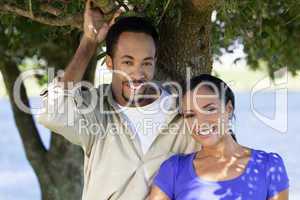 Happy African American Couple Together Under A Tree