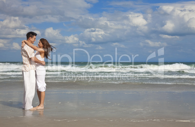 Man and Woman Couple Having In Romantic Embrace On Beach