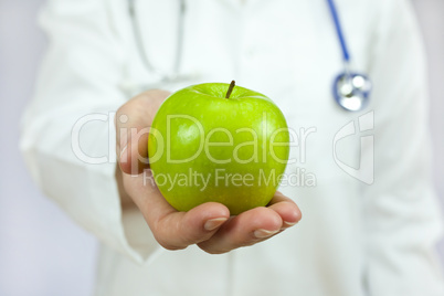 Doctor Holding Green Apple