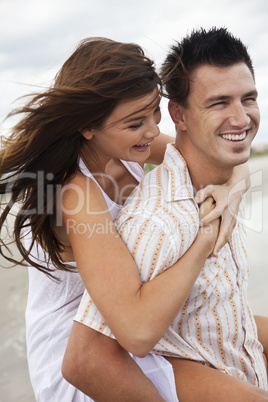 Man and Woman Couple Having Romantic Fun On Beach