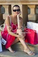 Beautiful Latina Hispanic Woman Sitting With Shopping Bags