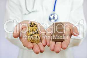 Doctor Offering Choice of Granola Bar and Chocolate